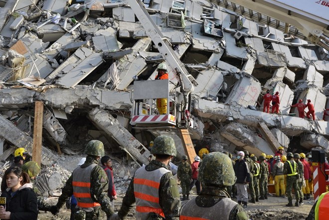 Hiện trường vụ sập chung cư do động đất ngày 6.2 vừa qua. Ảnh: AFP/TTXVN