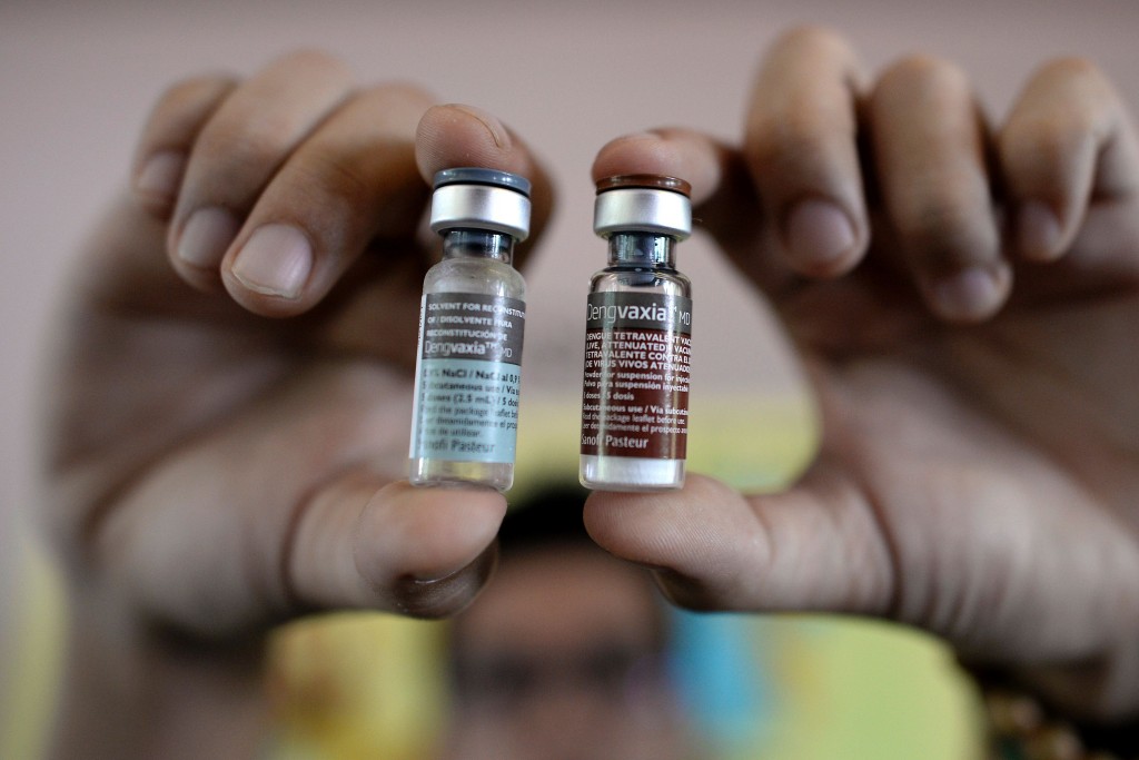 A nurse shows vials of the anti-dengue vaccine at Parang Elementary School in Marikina, west of Manila on April 4, 2016. The Philippines began injecting up to one million school children with the world's first vaccine for dengue fever, a mosquito-borne viral infection that is a leading cause of serious illness and death among children in some Asian and Latin American countries. / AFP / NOEL CELIS