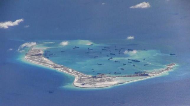 Chinese dredging vessels are purportedly seen in the waters around Mischief Reef in the disputed Spratly Islands in this still image from video taken by a P-8A Poseidon surveillance aircraft provided by the United States Navy May 21, 2015. REUTERS/U.S. Navy/Handout via Reuters