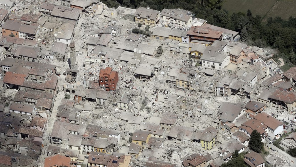 This aerial photo shows the damaged buildings in the town of Amatrice, central Italy, after an earthquake, Wednesday, Aug. 24, 2016. The magnitude 6 quake struck at 3:36 a.m. (0136 GMT) and was felt across a broad swath of central Italy, including Rome where residents of the capital felt a long swaying followed by aftershocks. (AP Photo/Gregorio Borgia) NYTCREDIT: Gregorio Borgia/Associated Press