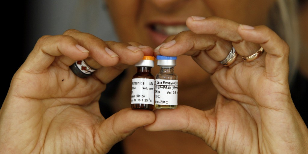 A Cuban health officer presents CimaVax EGF, medicine used in the treatment of advanced lung cancer, in Havana, Tuesday, June 24, 2008. Cuba began developing the medicine in 1992, and with its recent health and sanitary registration, Cuba could begin to commercialize it in Peru, Malaysia and China. CimaVax EGF medicine is a parallel treatment to chemotherapy, and is free for Cubans as part of their national health system. (AP Photo/Javier Galeano)