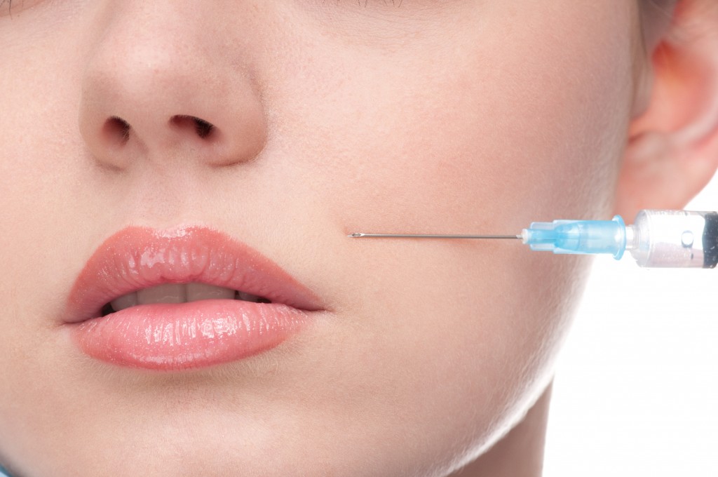 injection of botox to the face beautiful woman