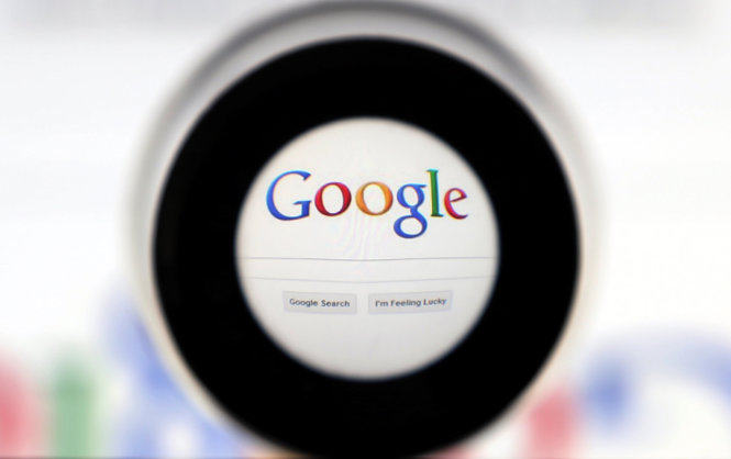 FILE PHOTO: A Google search page is seen through a magnifying glass in this photo illustration taken in Brussels May 30, 2014. REUTERS/Francois Lenoir/File Photo