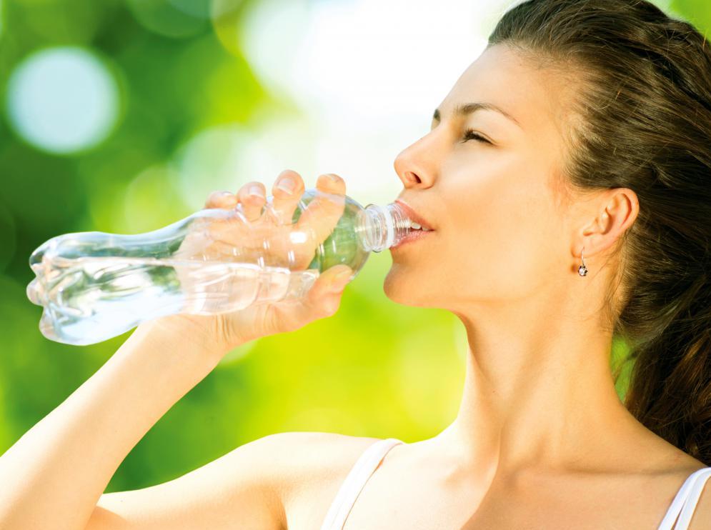 woman-drinking-out-of-bottle-of-water