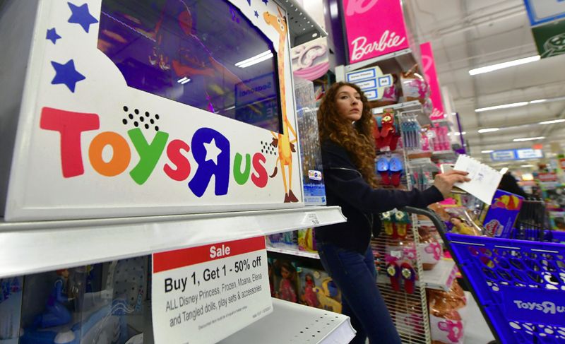 A woman shops at a Toys R Us store in Alhambra, California, on December 19, 2017 amid reports Toys R Us may close up to 200 stores across the US while suffering from weak holiday sales. Toys R US filed for Chapter 11 bankruptcy protection earlier this year and US sales have dropped some 15 percent this holiday season compared with a year ago. / AFP PHOTO / FREDERIC J. BROWN (Photo credit should read FREDERIC J. BROWN/AFP/Getty Images)